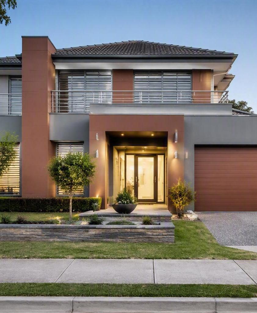 Maison moderne de deux étages avec entrée pavée et pelouse entretenue